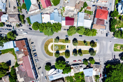 High angle view of trees and buildings in city