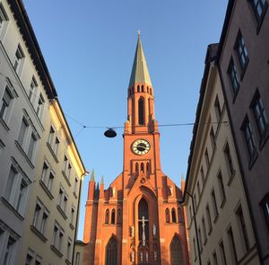 Low angle view of bell tower against sky