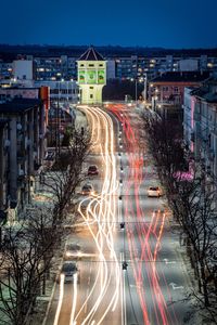 Light trails on road in city at night