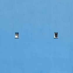 Low angle view of building against blue sky