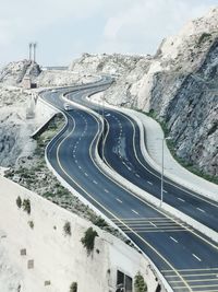 High angle view of road by mountain against sky