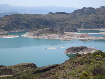 Scenic view of sea with mountain in background