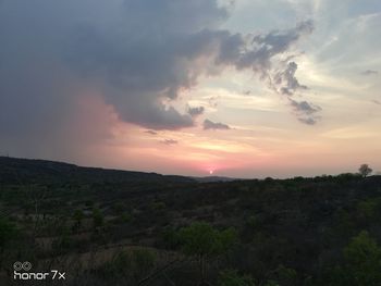 Scenic view of landscape against sky during sunset