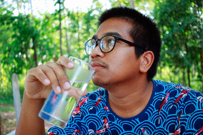 Young man drinking water