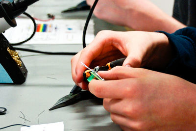 Close-up of hands working in workshop