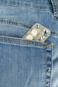 Close-up of buttons on blue table