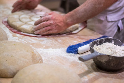 Close-up of man preparing food