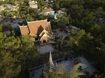 High angle view of houses by trees in town