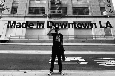 Full length of man standing on road