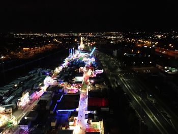 Aerial view of illuminated city at night