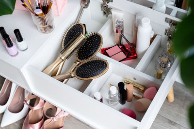 Closeup of elegant high heel shoes standing under feminine dressing table