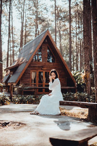 Women in pine forests and brown wooden houses