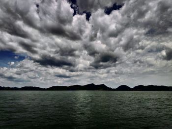 Scenic view of sea against cloudy sky