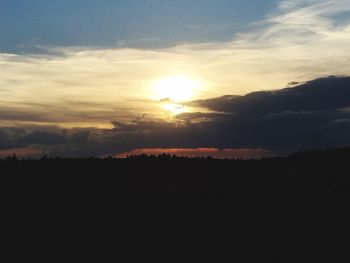 Silhouette of landscape against sunset