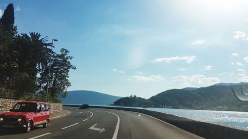 Cars on curved road along the adriatic sea 