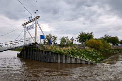 Bridge over river against sky