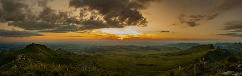 Scenic view of landscape against sky during sunset