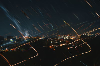 Aerial view of illuminated city at night