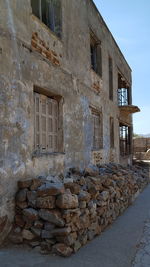 Old abandoned building against sky