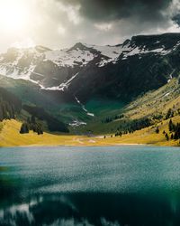 Scenic view of snowcapped mountains against sky