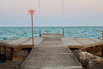 Pier over sea against sky