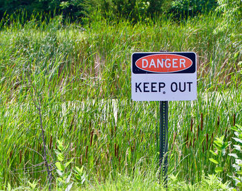 Road sign on field