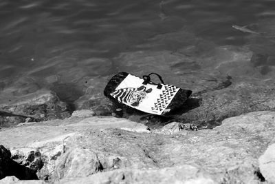 Plastic bag on rocky coastline