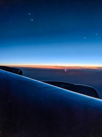 Airplane flying in sky at night