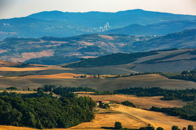 Scenic view of landscape and mountains against sky