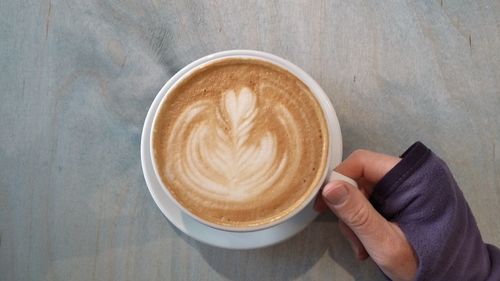 High angle view of coffee cup on table