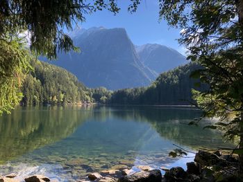 Scenic view of lake and mountains against sky