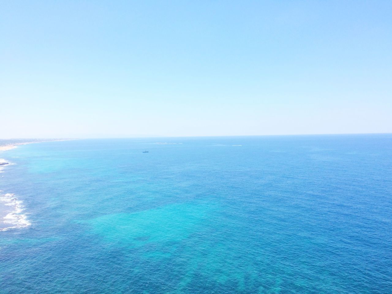 sea, clear sky, copy space, horizon over water, water, blue, tranquil scene, scenics, tranquility, beauty in nature, waterfront, nature, idyllic, seascape, rippled, day, outdoors, no people, ocean, remote