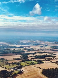 Aerial view of agricultural field against sky