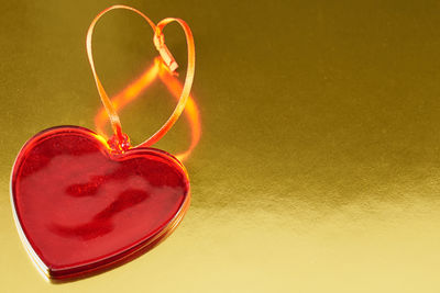Close-up of heart shape glass on table