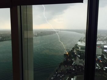 Scenic view of sea seen through window