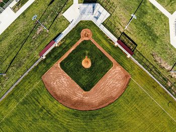 High angle view of fountain on lawn by building