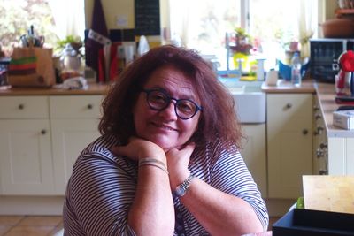 Portrait of mature woman in kitchen at home