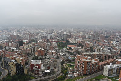 Aerial view of cityscape against sky