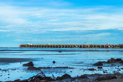 Scenic view of beach against blue sky