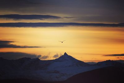 Scenic view of mountains against sky during sunset