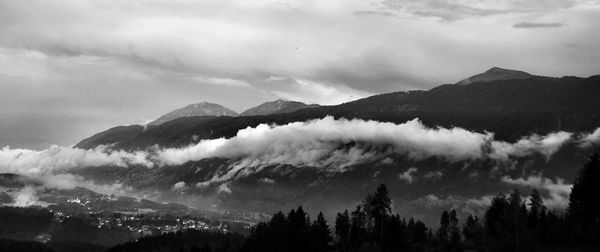 Scenic view of silhouette mountains against sky