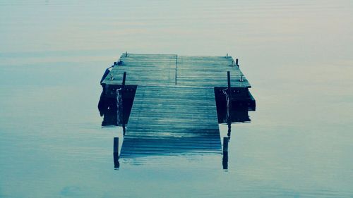 Broken jetty in lake