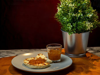 Traditional finnish cuisines. portion of desert bread cheese with cloudberry jam topping.