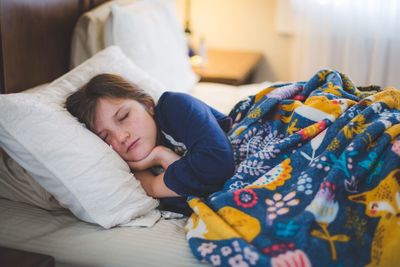 Woman lying on bed