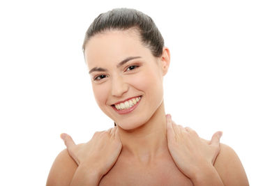 Portrait of a smiling young woman over white background