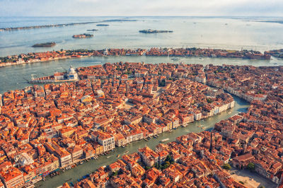 Aerial view of venice, san polo, italy. amazing city view from above on building roofs and canals.