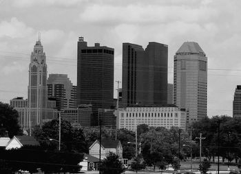 Skyscrapers in city against sky