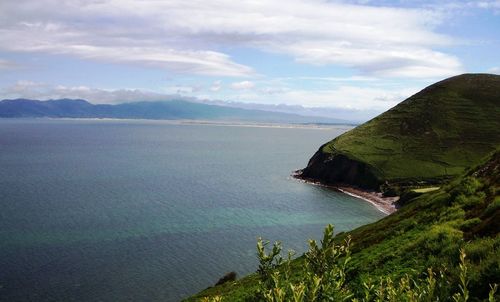 Scenic view of sea against cloudy sky