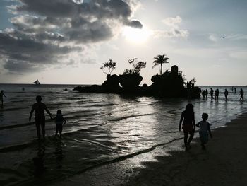 Silhouette of people on beach