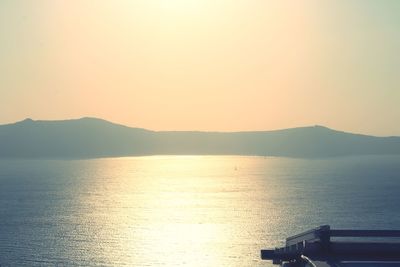 Scenic view of sea against clear sky during sunset